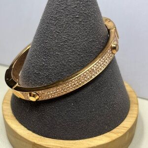 MICHAEL KORS rose gold tone pave crystal rhinestone oval clamper bracelet